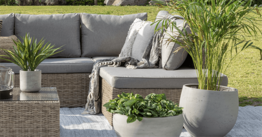 outdoor living scene - rattan sofa and table with plants