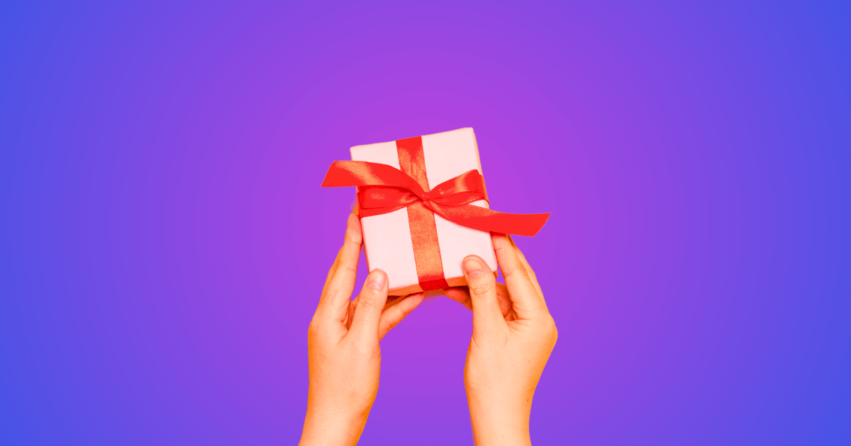 Hands holding a holiday-themed present.